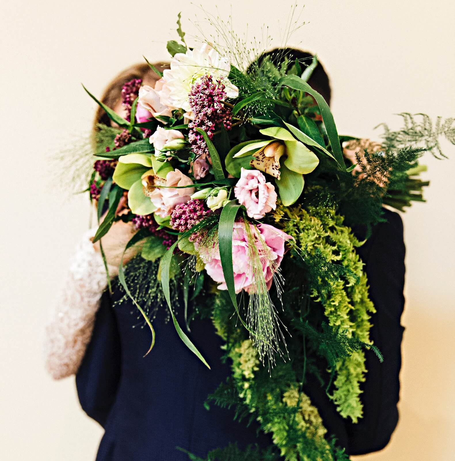 Cascading greens with pops of light and dark Purple flowers